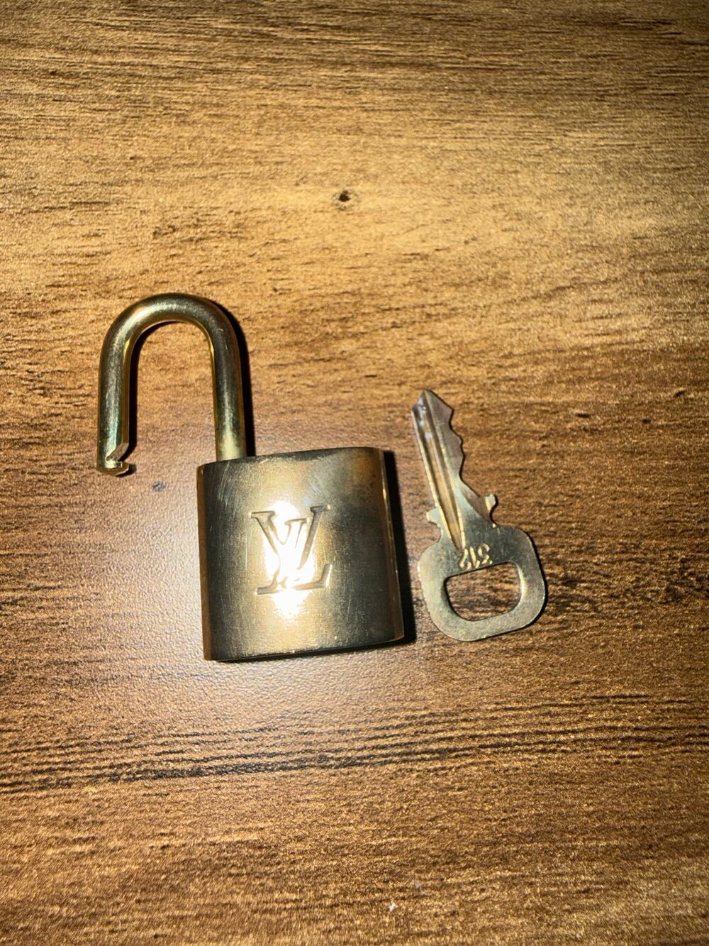 authentic Louis Vuitton solid brass padlock and matching key set, stamped 312